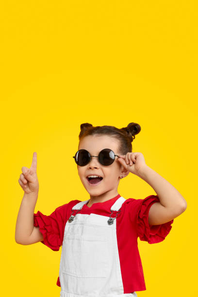 istock Girl in trendy sunglasses having idea 1154728739