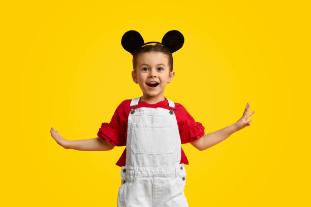 istock Cheerful girl with mouse ears 1154728758