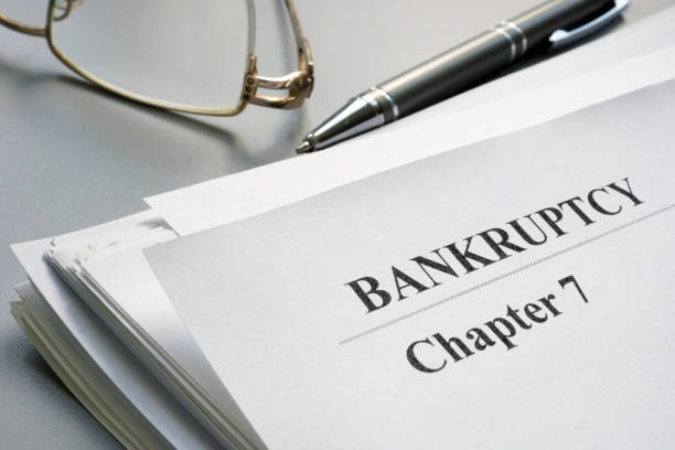 istock Chapter 7 Bankruptcy petition and glasses. 1154736614