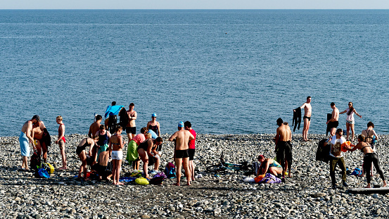 Sochi, Russia - May 18, 2019: a large group of people is enjoying their rest on the beach