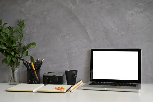 istock Workspace Table and laptop, camera, coffee on creative desk with loft wall. 1154744550