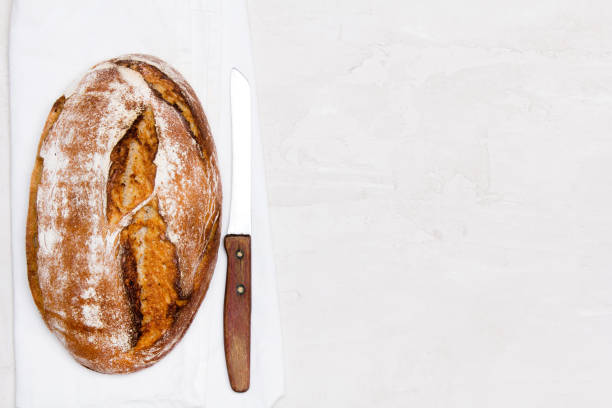 istock Tasty dark bread  on white background, copy space. Wholemeal bread. 1154746411
