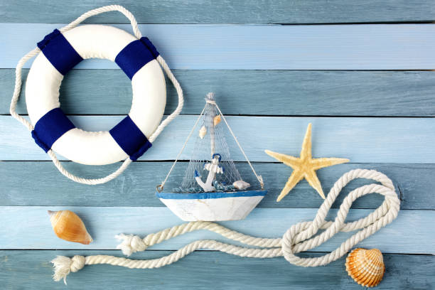 istock Few summer marine items on a wooden background. 1154747616