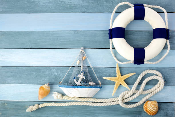 istock Few summer marine items on a wooden background. 1154747627