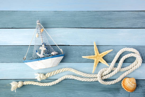 istock Few summer marine items on a wooden background. 1154747645