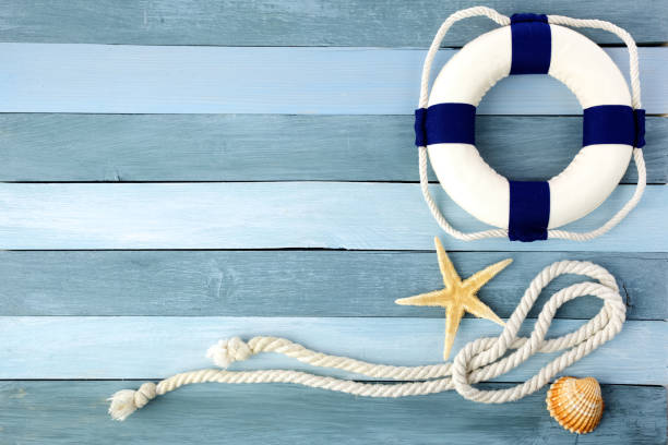 istock Few summer marine items on a wooden background. 1154747723
