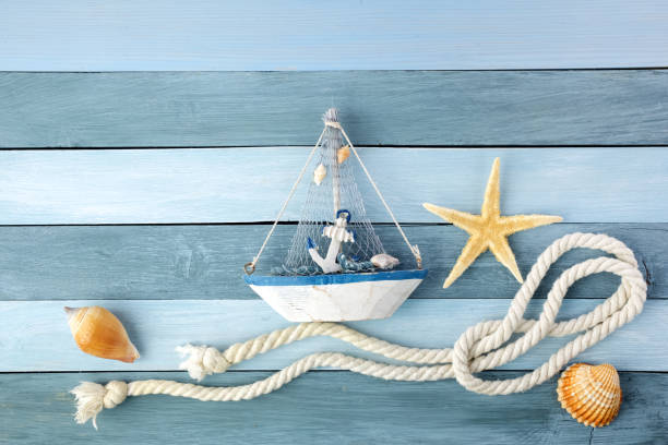 istock Few summer marine items on a wooden background. 1154747966