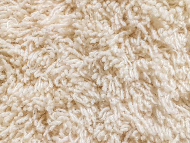 Cream cut pile carpet texture Close up cut pile carpet in cream color shaggy fur stock pictures, royalty-free photos & images