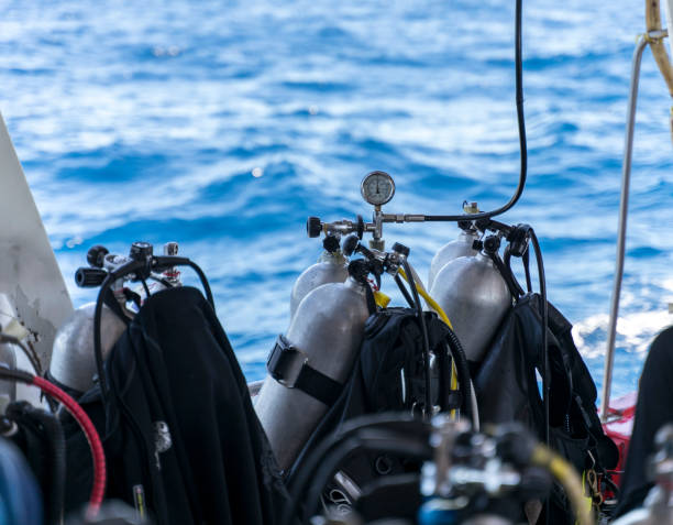 istock scuba regulator first stage and buoyancy control device bcd  on tank while fill the air 1154750371