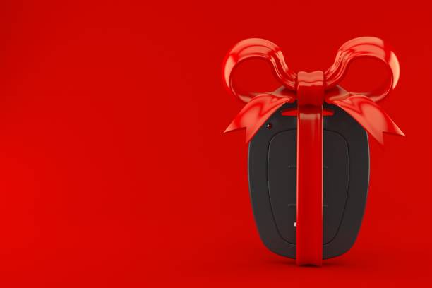 istock Car remote key with red ribbon 1154753880