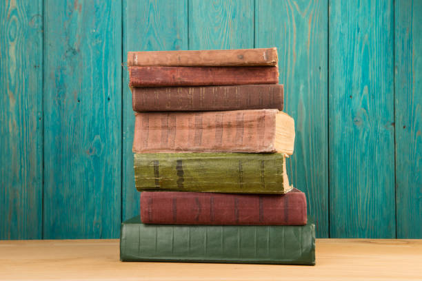 istock stack of books on the desk over wooden background 1154754329