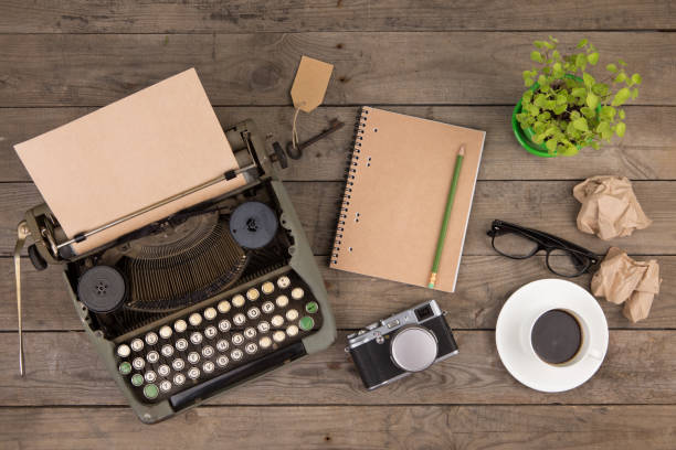 istock Vintage typewriter on the old wooden desk 1154755221