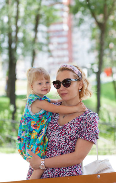 istock Mother and daughter on beautiful summer day 1154755388