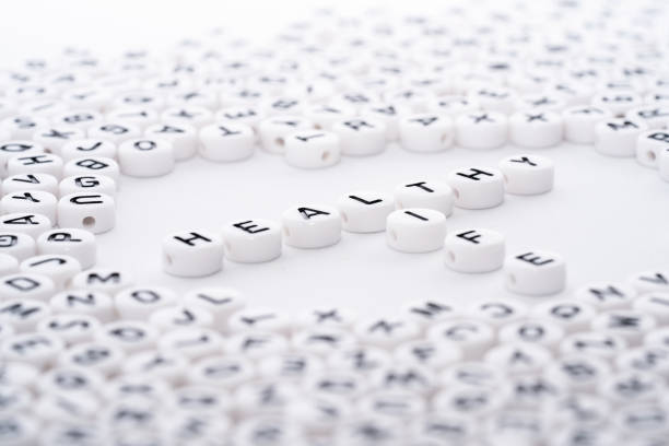 istock Healthy Life word written as a T, vertical and horizontal pattern on white blocks dice with black text corner view 1154755500