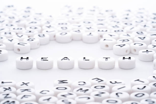 istock Health word text written with white blocks dice with black text top down view inside a heart of puzzle of words 1154755501