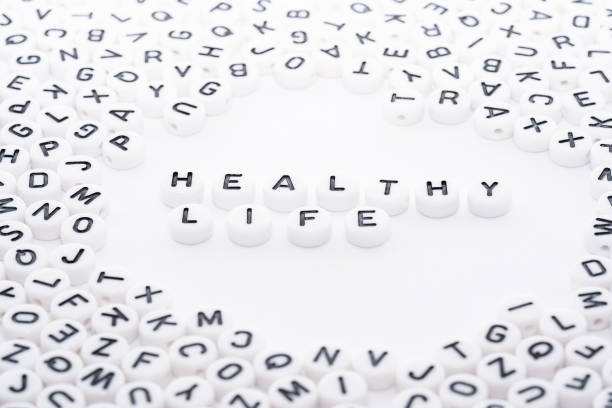 istock Healthy Life word written with white blocks dice with black text top down view 1154755517
