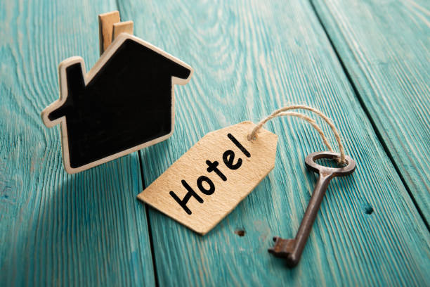 istock hotel key with tag on the wooden background 1154756307
