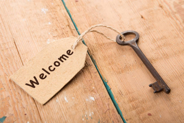 istock hotel key with welcome tag on the wooden background 1154756350