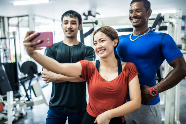 istock Asian friends taking selfie at the gym 1154756652