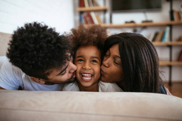 istock Cute african american family 1154761168