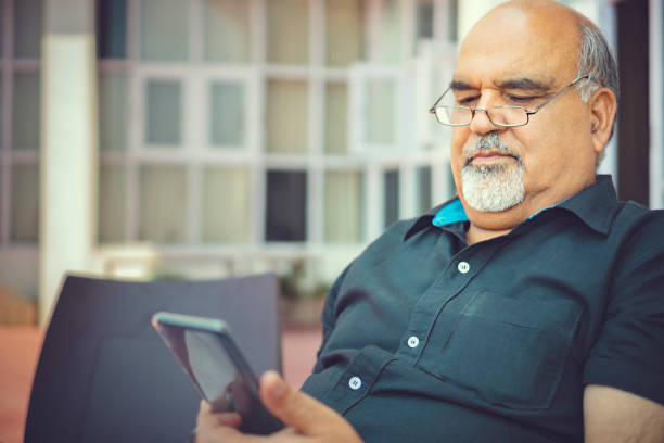 istock Senior man uses a smartphone. 1154765993