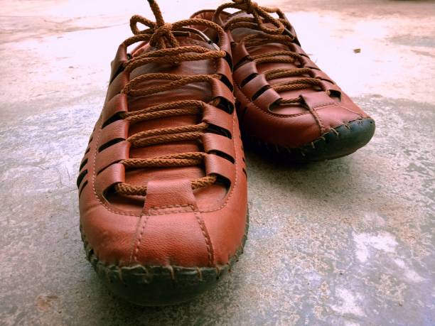 Rajasthani shoe Very flexible leather giving a comfortable fit handmade indian shoes on white stock pictures, royalty-free photos & images