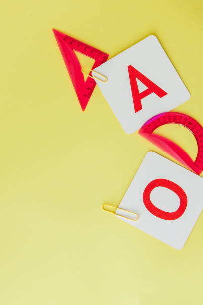 istock Back to school concept with space for text. Top view. Copy space. School office supplies.Creative desk with colourful stationery. Colored paper clip.School supplies on yellow background.Office desk 1154771395