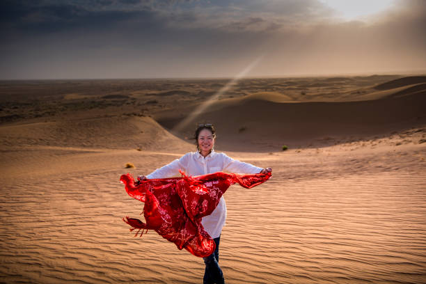 A young lady enjoying her desert trip to Kashan, Iran