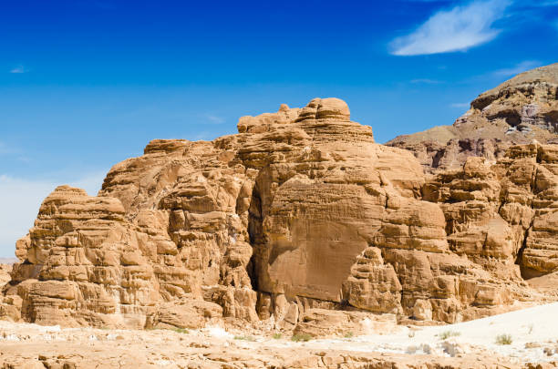 istock high rocky mountains against the blue sky and white clouds in the desert in Egypt Dahab South Sinai 1154774708