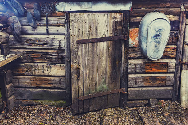 istock old wooden door of a collapsed barn. 1154777360