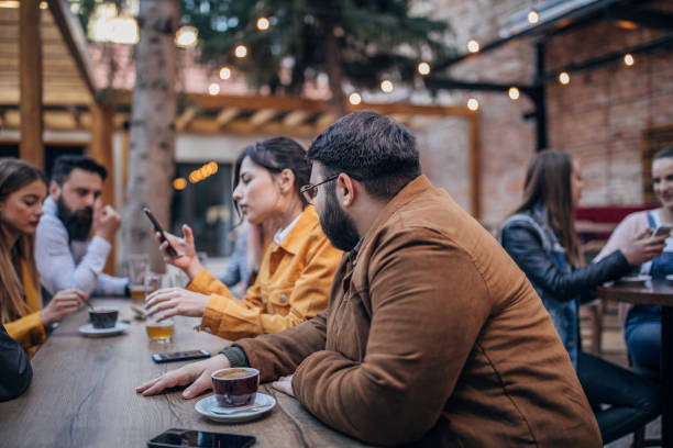 istock Friends drinking beer and coffee in a pub garden 1154778251