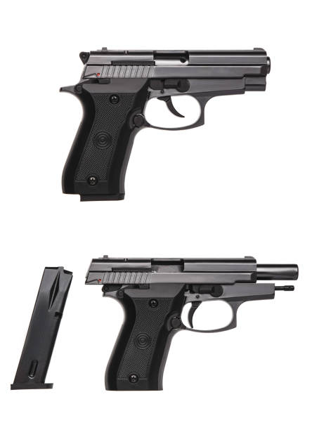 istock Black gun pistol isolated on white background 1154779297