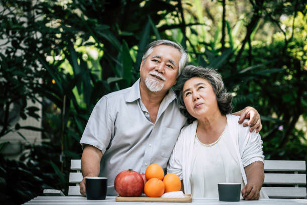 istock Elderly Couples Playing and eating some fruit 1154779592