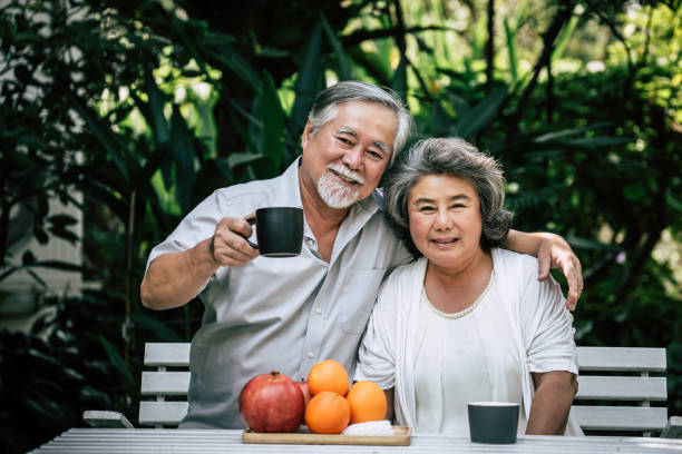 istock Elderly Couples Playing and eating some fruit 1154779668