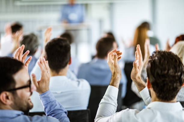 istock Back view of business people applauding on a seminar. 1154779894