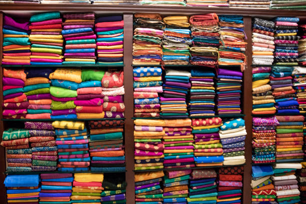Textiles Picture was taken on 26th of June 2018 in Textiles Store in Kochi, Kerala, India. Shelves of colourful materials, scarfs. fabric shop stock pictures, royalty-free photos & images