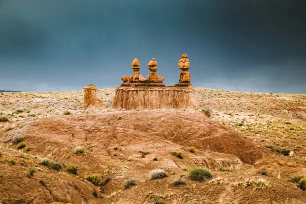 Panoramic view of beautiful hoodoos sandstone formations in Goblin Valley State Park during a summer thunder, Utah, USA