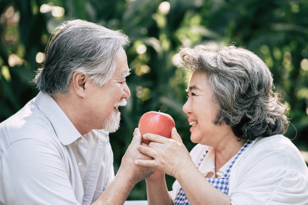 istock Elderly couples Cooking Healthy food together 1154787201