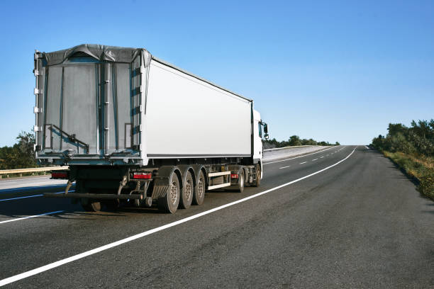 istock The truck is going up the road. Cargo transportation concept. 1154787523