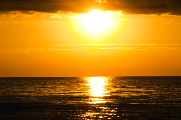 istock orange sunset above sea 1154788574
