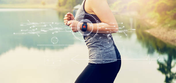 Young woman running and technology healthcare wellness with the screen icon innovation and sports watch, performance of body. Young woman running and technology healthcare wellness with the screen icon innovation and sports watch, performance of body. womens track stock pictures, royalty-free photos & images