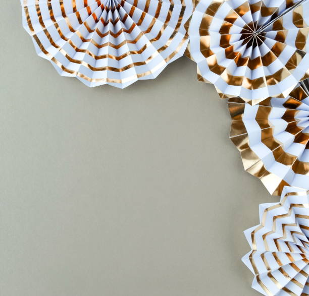 istock christmas or new year frame decorations in gold colors on grey color background with empty copy space for text. Xmas, holiday and celebration concept for postcard or invitation. top view 1154792499