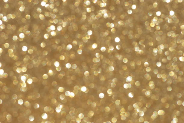 istock blur glitter or bokeh gold festive background,  texture. Xmas abstract background with copy space. 1154792689