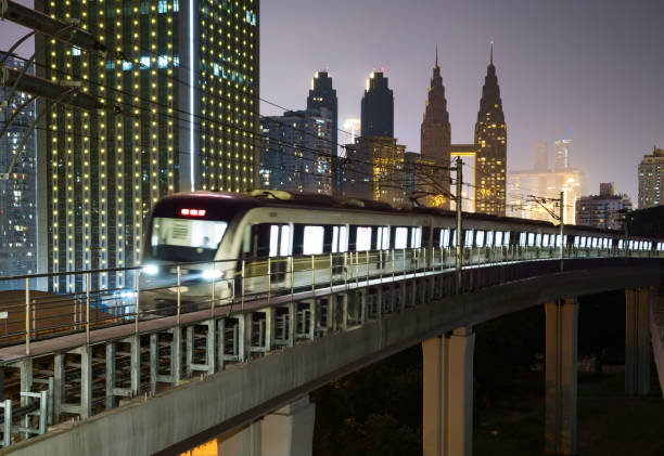 istock At night, the light rail train shuttles through the city 1154794007