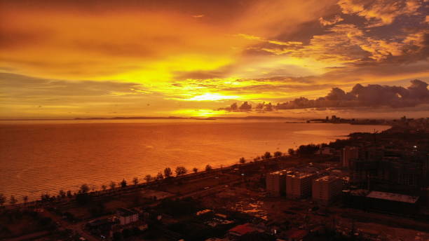 istock Colourful sunset with clouds at the ocean 1154794242