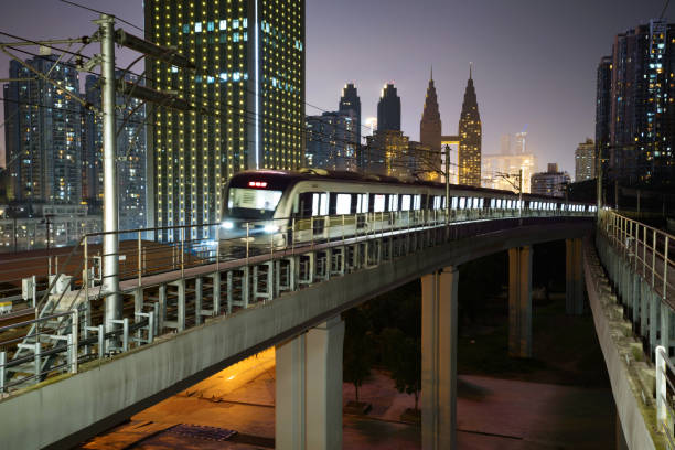 istock At night, the light rail train shuttles through the city 1154794359