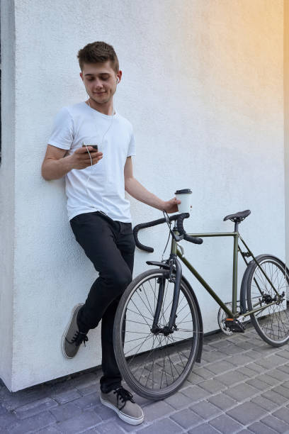istock Handsome hipster man posing with bicycle in the city. 1154797974