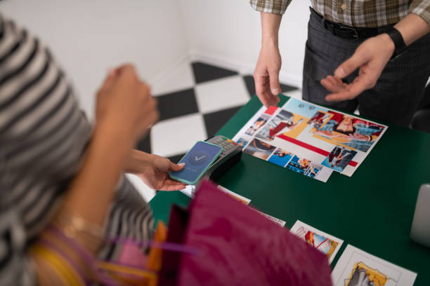 istock Close-up shot of customer paying using PayPass on the smartphone 1154798821