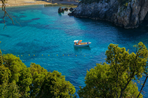 istock Beautiful landscape with sea and small boat on a water surface 1154800918