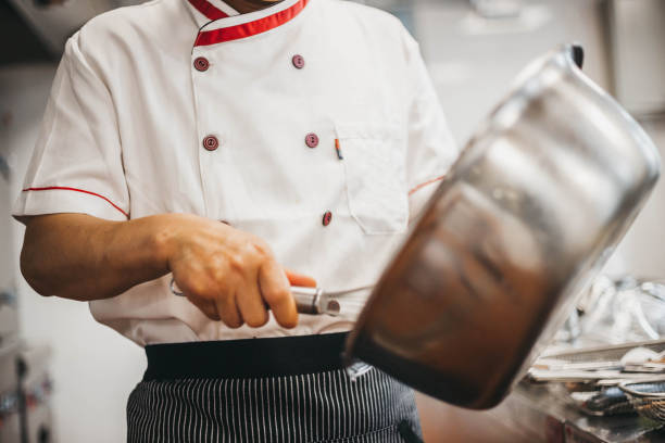 istock Chef preparing food in Asian restaurant 1154801389